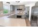 Bright kitchen featuring gray cabinets, stainless steel appliances, and ample counter space at 2008 Bantry Ln, Charlotte, NC 28262