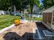 A brick patio features a water fountain and furniture for outdoor relaxation at 2008 Bantry Ln, Charlotte, NC 28262