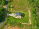Aerial view of the home showcasing the lush landscaping and driveway at 207 9Th Ne Ct, Conover, NC 28613
