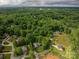 An aerial view showcases this neighborhood's homes nestled among mature trees and winding streets at 207 9Th Ne Ct, Conover, NC 28613