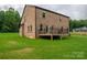 A spacious backyard and deck are attached to this brick home, great for outdoor activities at 207 9Th Ne Ct, Conover, NC 28613