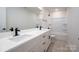 Bathroom featuring double vanity with white countertop and cabinets and black hardware at 207 9Th Ne Ct, Conover, NC 28613
