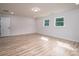 Spacious bedroom with ample natural light, two windows, and light wood-look flooring at 207 9Th Ne Ct, Conover, NC 28613