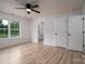 Bright bedroom with a ceiling fan, two closets, and a view into the ensuite bathroom at 207 9Th Ne Ct, Conover, NC 28613