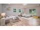 Bright bedroom with two twin beds and hardwood flooring at 207 9Th Ne Ct, Conover, NC 28613