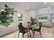 Bright dining area features a glass table and views of the green outdoors through large windows at 207 9Th Ne Ct, Conover, NC 28613