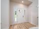Bright entryway featuring a white door with glass panels and light wood-look flooring at 207 9Th Ne Ct, Conover, NC 28613