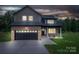 Charming two-story home with brick and siding exterior, featuring an attached garage and manicured front lawn at 207 9Th Ne Ct, Conover, NC 28613