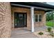 Exterior view of a brick home with a black front door and white pillar at 207 9Th Ne Ct, Conover, NC 28613