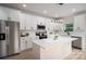 Modern kitchen with white cabinets, stainless steel appliances, quartz countertops, and center island with pendant lighting at 207 9Th Ne Ct, Conover, NC 28613