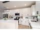 Modern kitchen with white cabinets, stainless steel appliances, quartz countertops, and center island with pendant lighting at 207 9Th Ne Ct, Conover, NC 28613