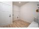 Functional laundry room with white cabinets, shelving, and space for laundry appliances at 207 9Th Ne Ct, Conover, NC 28613