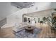 Open-concept living room showcases stairs, modern kitchen and leads to the dining area creating a spacious home at 207 9Th Ne Ct, Conover, NC 28613