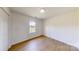 Bedroom featuring neutral walls, laminate flooring, and a window at 2377 Mintew Cir, Lincolnton, NC 28092