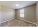 Bedroom featuring neutral walls, carpeted floor, and a window at 2377 Mintew Cir, Lincolnton, NC 28092