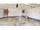 Attached two-car garage with wooden shelving at 2377 Mintew Cir, Lincolnton, NC 28092