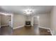 Spacious living room features a decorative fireplace, fan, and hardwood floors at 2377 Mintew Cir, Lincolnton, NC 28092