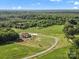 Expansive aerial view of a secluded home nestled in lush greenery with long private drive at 2521 Neely Store Rd, Rock Hill, SC 29730