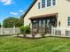 Backyard patio features two hanging egg chairs with dark trim and a well-maintained lawn at 2521 Neely Store Rd, Rock Hill, SC 29730