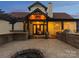 The backyard patio features an outdoor kitchen, fire pit, and lounge area, perfect for entertaining guests at 2521 Neely Store Rd, Rock Hill, SC 29730