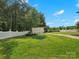 Lush backyard featuring a shed and white picket fence surrounded by mature trees and manicured lawn at 2521 Neely Store Rd, Rock Hill, SC 29730