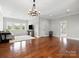 Spacious bonus room with hardwood floors, a chandelier, and lots of natural light at 2521 Neely Store Rd, Rock Hill, SC 29730