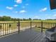 Large deck with railing, a beautiful view of the meadow, and outdoor seating at 2521 Neely Store Rd, Rock Hill, SC 29730