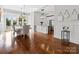 Bright dining area featuring hardwood floors, elegant lighting, and views of the outdoors at 2521 Neely Store Rd, Rock Hill, SC 29730