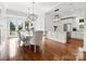 Bright dining area featuring hardwood floors, elegant lighting, and views of the outdoors at 2521 Neely Store Rd, Rock Hill, SC 29730