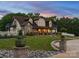 Charming exterior of a multi-story home with manicured lawn, stone accents, and inviting front porch at 2521 Neely Store Rd, Rock Hill, SC 29730