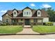 Charming two-story home with stone accents, inviting front porch, and lush green lawn at 2521 Neely Store Rd, Rock Hill, SC 29730