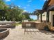 Stone patio with a fire pit, grill, outdoor kitchen and pergola, perfect for entertaining at 2521 Neely Store Rd, Rock Hill, SC 29730
