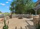 Stone patio with a circular fire pit and a curved stone bench for relaxing outdoors at 2521 Neely Store Rd, Rock Hill, SC 29730