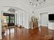 Spacious foyer with gleaming hardwood floors, stylish lighting, and an open entryway at 2521 Neely Store Rd, Rock Hill, SC 29730