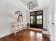 Elegant foyer with hardwood floors, stylish console table, and double glass front doors at 2521 Neely Store Rd, Rock Hill, SC 29730