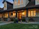 Close-up of a cozy front porch with stone columns, inviting entryway, and well-maintained landscaping at 2521 Neely Store Rd, Rock Hill, SC 29730