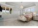 Luxurious main bedroom with neutral walls, soft carpet, a chandelier, and large windows at 2521 Neely Store Rd, Rock Hill, SC 29730