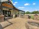 Spacious outdoor patio with fire pit, grill, outdoor kitchen, and covered seating area at 2521 Neely Store Rd, Rock Hill, SC 29730