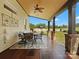 Charming covered patio with wood ceiling, dining table and chairs overlooking a green yard at 2521 Neely Store Rd, Rock Hill, SC 29730