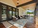 Covered porch with lounge chairs, a dining set, and a stone fireplace at 2521 Neely Store Rd, Rock Hill, SC 29730