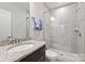 Modern bathroom featuring a glass-enclosed shower and granite vanity at 310 N Dotger N Ave # 4, Charlotte, NC 28204