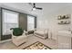 Cozy Bedroom featuring a neutral color palette, a white crib and seating at 310 N Dotger N Ave # 4, Charlotte, NC 28204