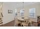 Dining area featuring a round table, seating for six, and large windows offering natural light at 310 N Dotger N Ave # 4, Charlotte, NC 28204