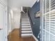 Inviting entryway featuring hardwood floors and a staircase with wooden railings at 310 N Dotger N Ave # 4, Charlotte, NC 28204
