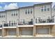 Townhome exterior showcasing private rooftop decks and attached garages at 310 N Dotger N Ave # 4, Charlotte, NC 28204