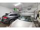 Spacious garage with overhead storage racks and room for two cars at 310 N Dotger N Ave # 4, Charlotte, NC 28204