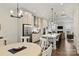 Open-concept kitchen and dining area with stainless steel appliances and hardwood floors at 310 N Dotger N Ave # 4, Charlotte, NC 28204