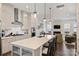 Bright kitchen with a central island featuring pendant lighting and an integrated sink at 310 N Dotger N Ave # 4, Charlotte, NC 28204