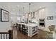 Open kitchen with stainless steel appliances, island with barstool seating, and an eat-in dining area at 310 N Dotger N Ave # 4, Charlotte, NC 28204