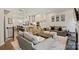Open-concept living room flowing into the kitchen with modern decor and recessed lighting at 310 N Dotger N Ave # 4, Charlotte, NC 28204